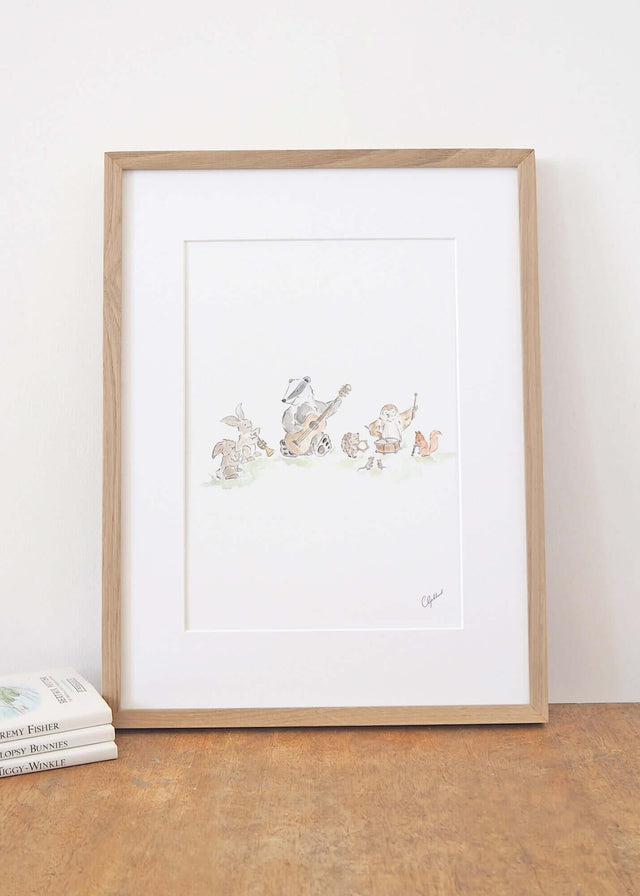 Nursery print of woodland animals playing musical instruments, illustrated by Carla Gebhard.