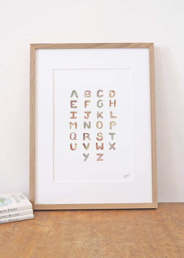 Framed gender neutral alphabet print for children, painted by Carla Gebhard.