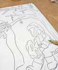 A close up of inside the children's '12 days of Christmas' colouring book.