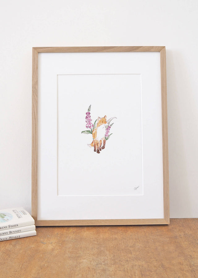 Framed watercolour print of a fox and pink foxgloves, painted by Carla Gebhard.