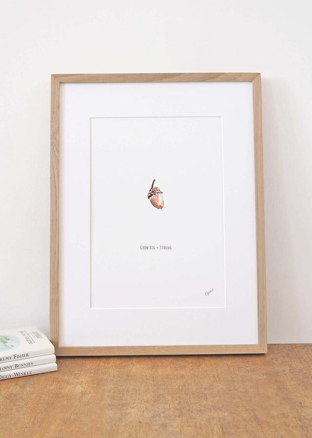 Framed 'Grow big and strong' acorn nursery print, by Carla Gebhard.