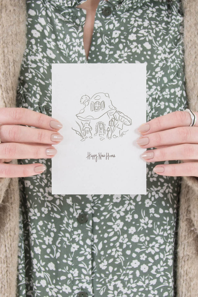 New home card of a fairy mushroom, by Carla Gebhard.