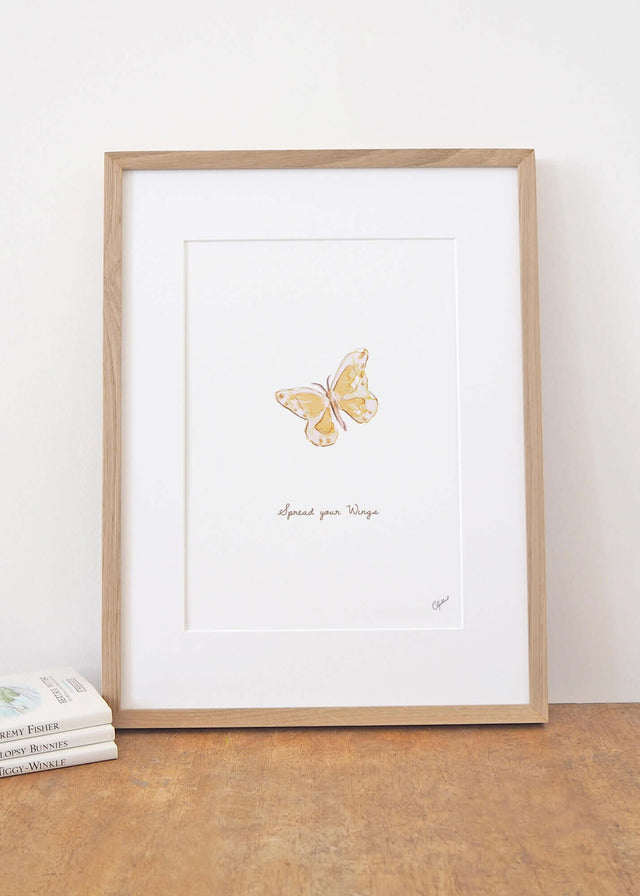 Framed 'Spread your wings' yellow butterfly print, by Carla Gebhard.